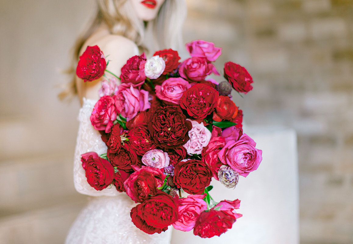 red and pink rose wedding bouquet